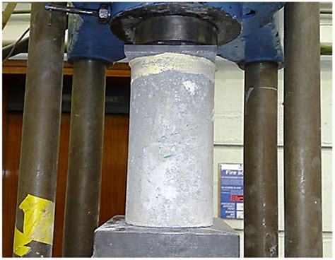 Axial compression test on strengthening concrete cylinders by Fe 